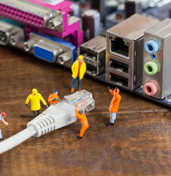 miniature-engineer-worker-plug-lan-cable-computer